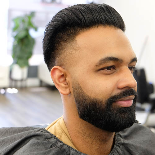 Young man with a nicely groomed beard from MGX Barbers